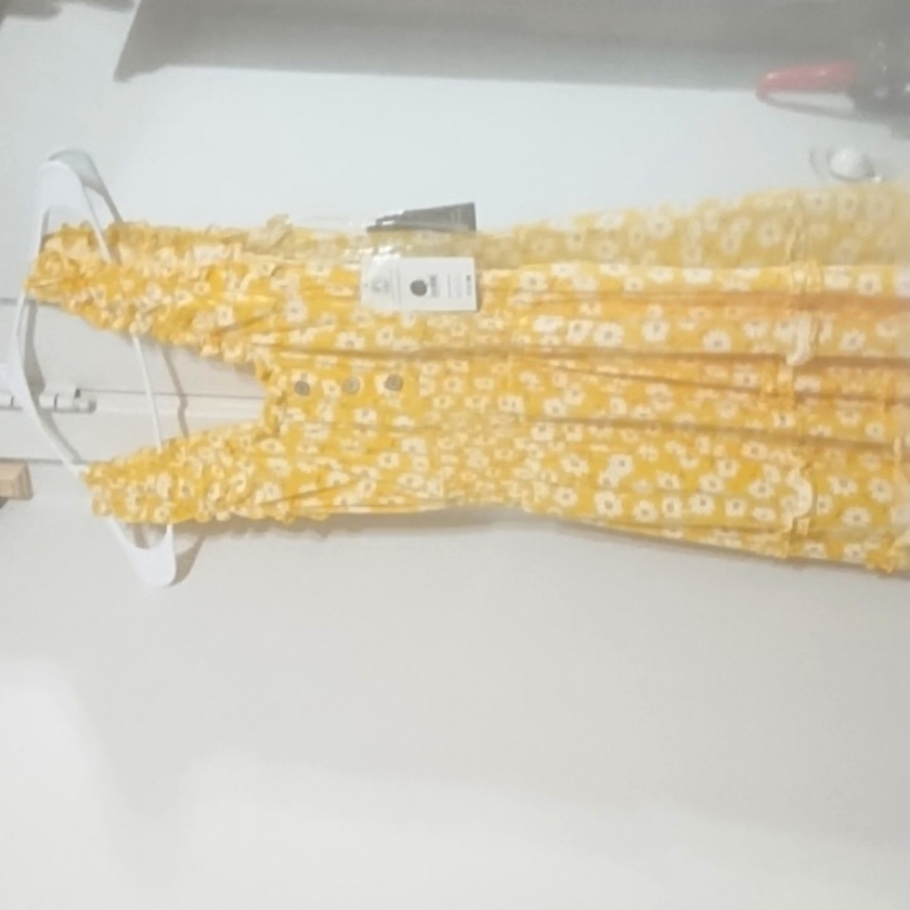 Yellow sundress with design white flowers